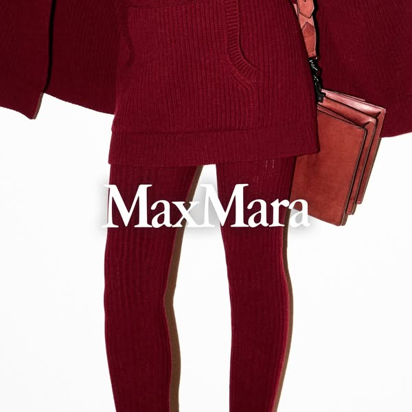 This ad showcases a Max Mara outfit, consisting of a red knit dress, red tights with a brown stripe, and a red purse. Th