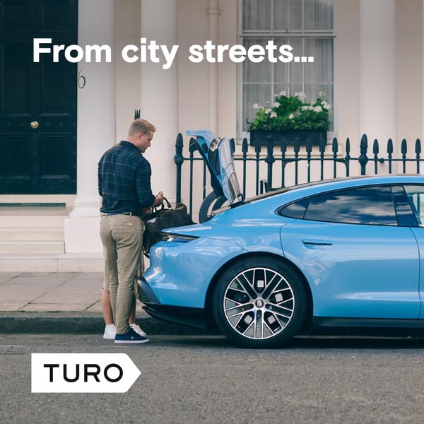 This ad for Turo features a man loading a bag into the trunk of a light blue car in front of a city building. The ad is 