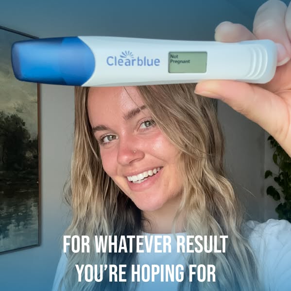 This image ad features a smiling woman holding up a Clearblue pregnancy test that reads "Not Pregnant." The ad