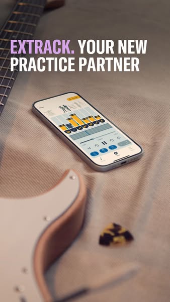 This ad promotes a music practice app called Extrack. The ad features a phone displaying the app interface, positioned n