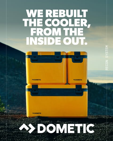 This image ad for Dometic features a stack of yellow coolers in an outdoor setting. The ad emphasizes the brand's co