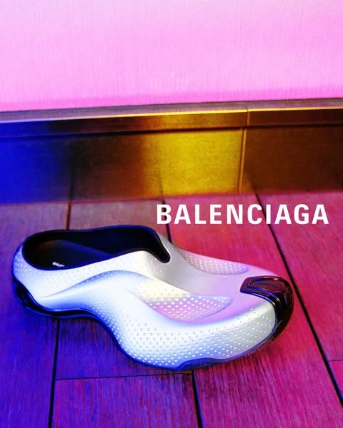 This ad showcases a single Balenciaga shoe against a colorful background.