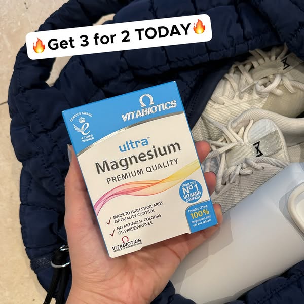 This ad features a hand holding a box of Vitabiotics Ultra Magnesium supplements from a bag containing gym clothes, with