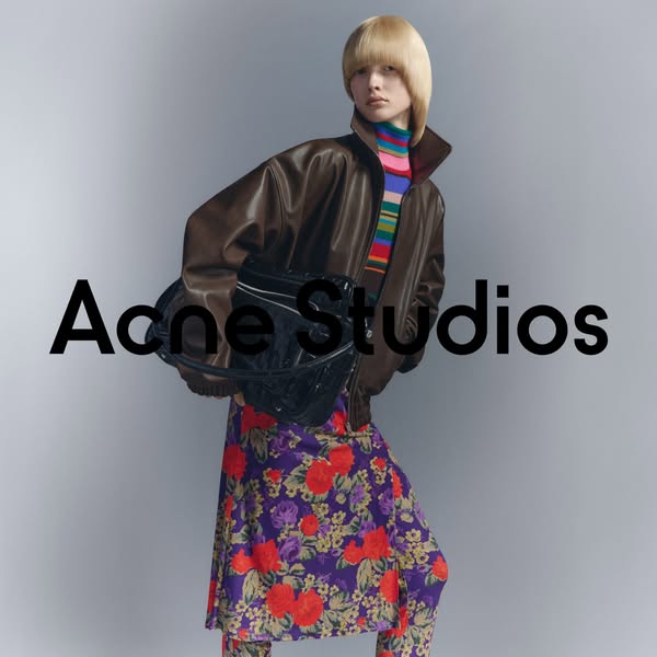 This ad features a model wearing Acne Studios clothing and carrying an Acne Studios bag. The brand name is prominently d
