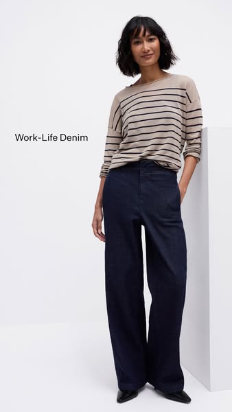 This image ad features a woman wearing a beige and black striped long sleeve shirt and wide leg denim pants.