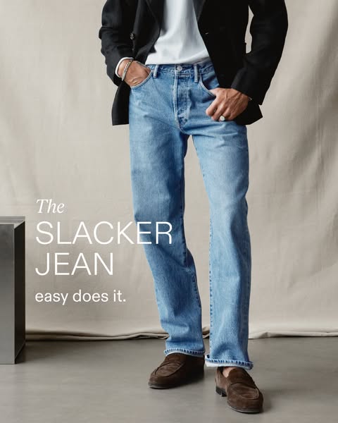 The ad features a full shot of a person modeling The Slacker Jean paired with a blazer and loafers.