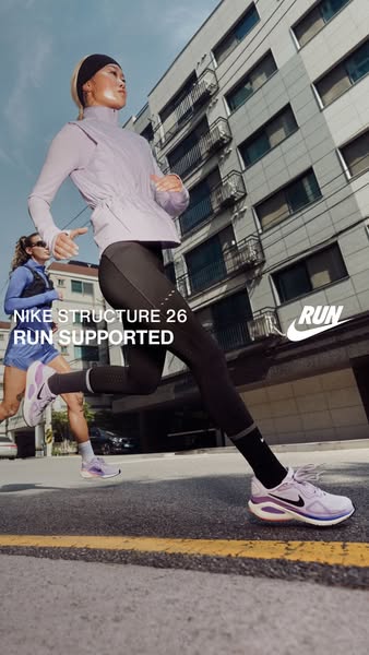 This ad showcases the Nike Structure 26 running shoe, emphasizing its support features for runners. The ad features two 
