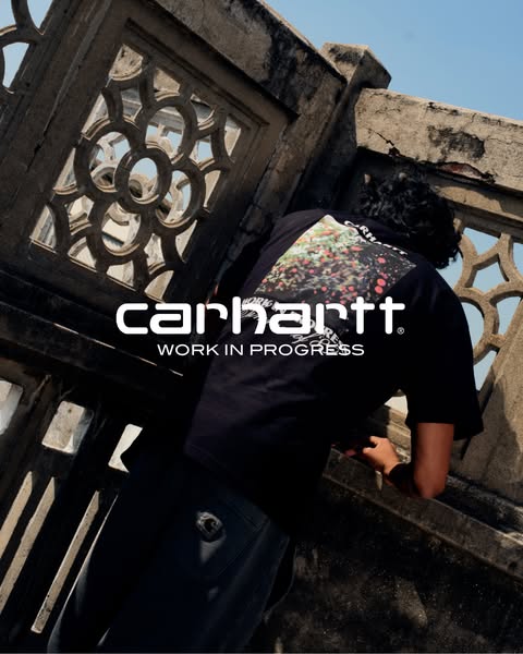 This ad features a person wearing a black Carhartt Work In Progress t-shirt, photographed from the back. The brand logo 