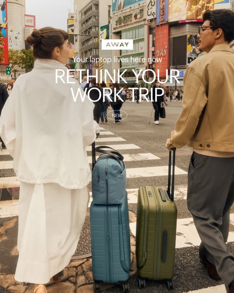 This image ad by Away shows a couple walking through a busy city intersection with Away brand luggage, prompting viewers