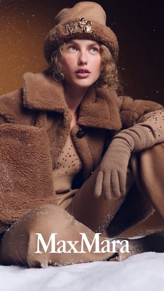 This ad features a woman in winter clothing, promoting the Max Mara brand. The ad focuses on the luxurious and stylish a