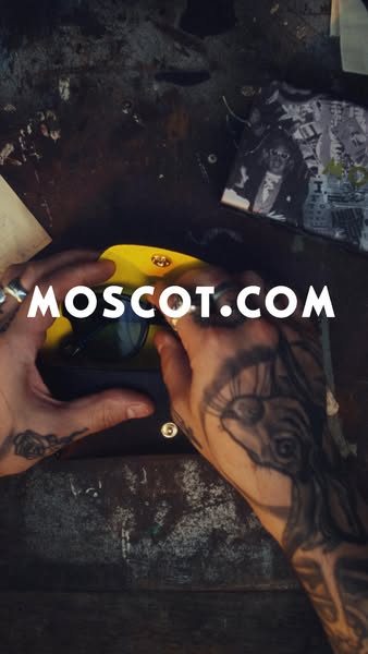 An image ad featuring a pair of MOSCOT sunglasses in their case, with the website address for MOSCOT overlaid on the pro