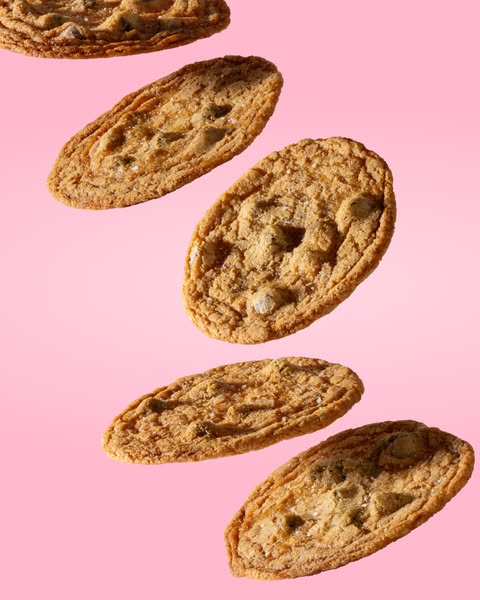 This ad features a visually appealing display of cookies against a pink background, emphasizing their texture and appear