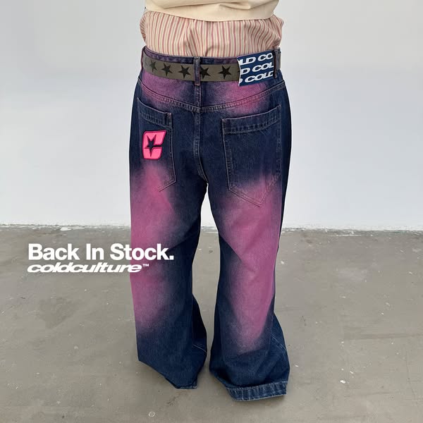 This ad showcases a pair of Cold Culture jeans with a pink and blue wash. The jeans are worn by a person whose upper bod