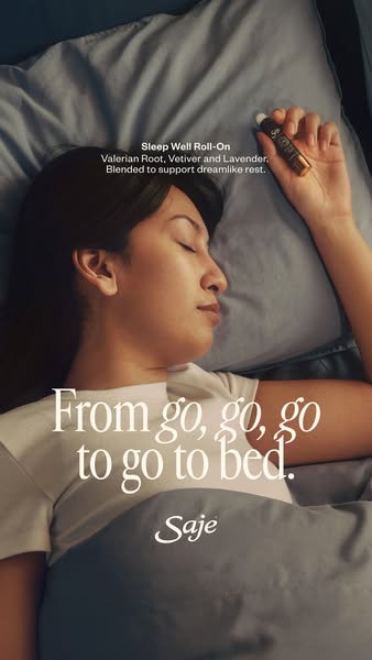 This ad is for Saje's Sleep Well Roll-On. The image shows a woman laying in bed ready to go to sleep. The text state