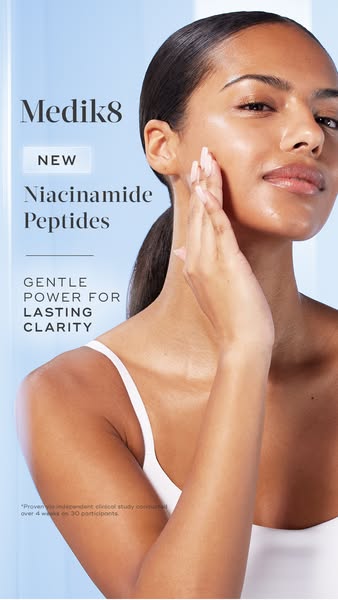 This ad for Medik8 promotes their new Niacinamide Peptides product. The ad features a woman with clear skin touching her