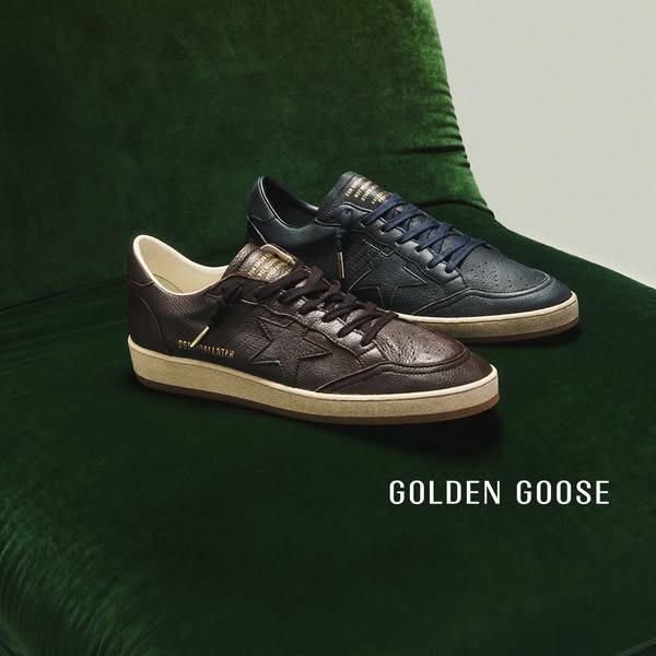 This ad features a pair of Golden Goose Ball Star sneakers on a green velvet surface. The focus is on showcasing the sty