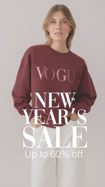 This image ad promotes a New Year's sale of up to 60% off. The ad features a woman wearing a burgundy sweatshirt wit