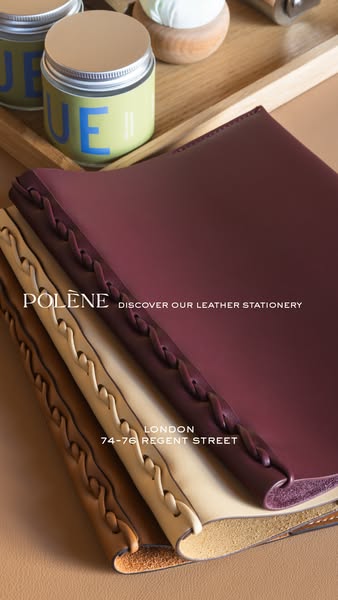 This ad by Polène showcases their leather stationary line with a focus on a set of three notebooks in different colors. 