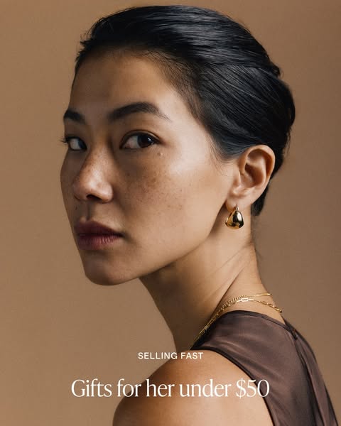 An advertisement featuring gifts for her under $50. The ad features an image of a woman wearing jewelry.
