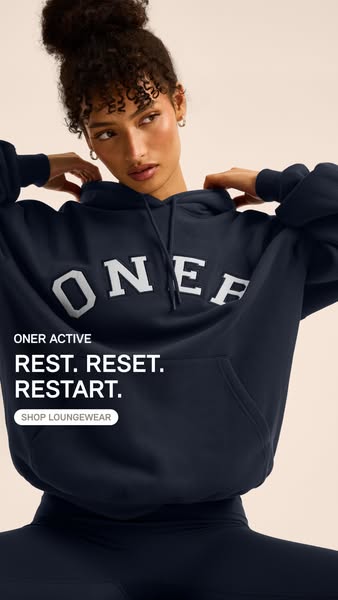 The ad features a woman wearing loungewear from ONER Active. The ad uses the copy "REST. RESET. RESTART." to c
