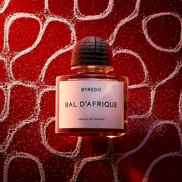 A close up shot of the Byredo Bal D'Afrique perfume bottle with a unique background.
