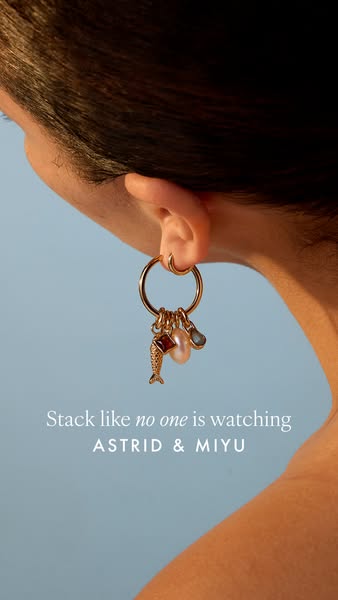 This ad showcases a singular earring from ASTRID & MIYU and encourages the viewer to 'stack like no one is watch