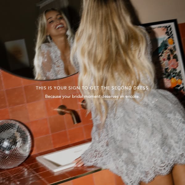 The ad is for a second bridal dress. It features a woman wearing a white dress looking in the mirror. The ad text says &