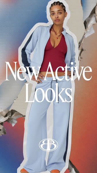 This image ad presents a new activewear look. It features a woman in a blue tracksuit with a deep red top, set against a