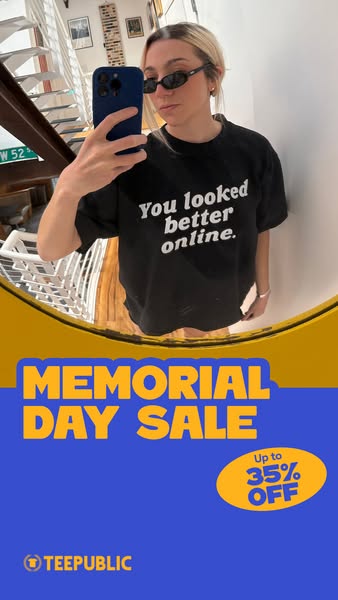 This image ad features a young woman in front of a mirror, holding up her phone to take a selfie. She is wearing a black