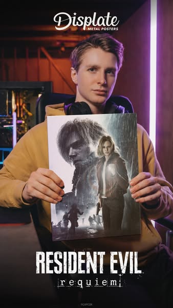 A man in a casual setting holds a Displate metal poster of the game Resident Evil requiem.
