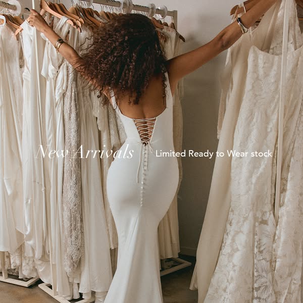 This image ad showcases a woman in a white dress, surrounded by other dresses, with the text "New Arrivals Limited 