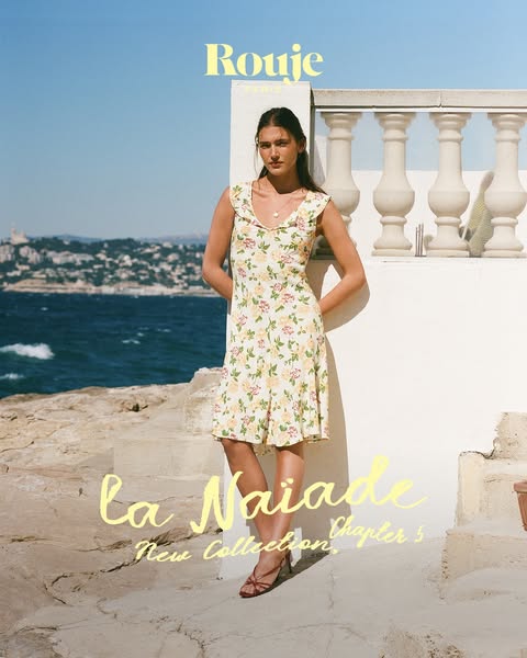 This ad features a young woman posing outdoors wearing a floral dress from Rouje. The ad highlights the dress as part of