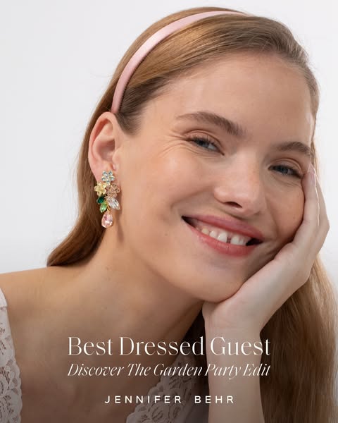 An image ad for Jennifer Behr jewelry showcases a single earring and a satin headband. The ad is promoting the brand'
