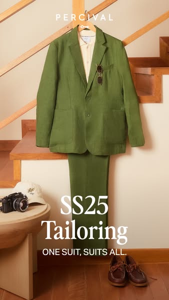 This ad promotes Percival's tailoring. The main element in the image is an olive green suit, with the caption 'S