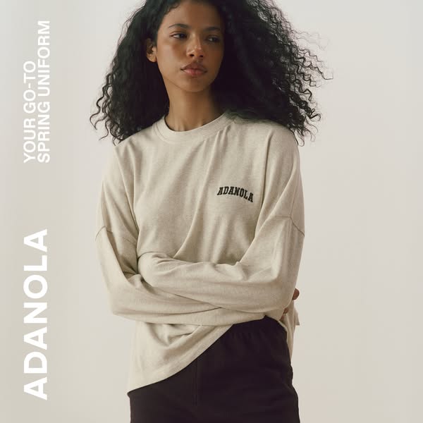 This ad features a woman wearing the brand's long sleeve shirt with the brand name printed on the front. The ad is m