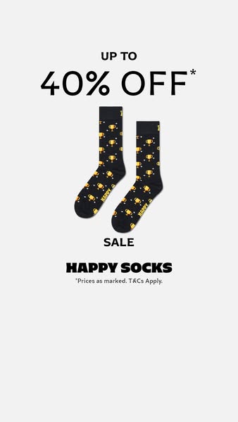 This image ad promotes Happy Socks with a sale of up to 40% off. The ad features a pair of black socks with a trophy pat