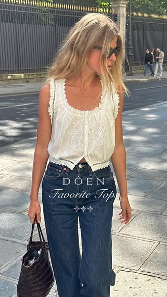 This ad features a woman walking in an outdoor setting wearing a white blouse and jeans. The text overlay promotes the b