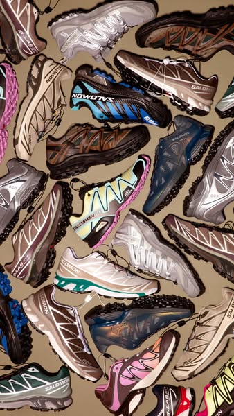 A product shot showcasing a collection of Salomon running shoes. The ad emphasizes Salomon's athletic and outdoorsy 