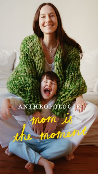 This ad features a mother and child sitting close together, both smiling and wearing clothing sold by Anthropologie. The
