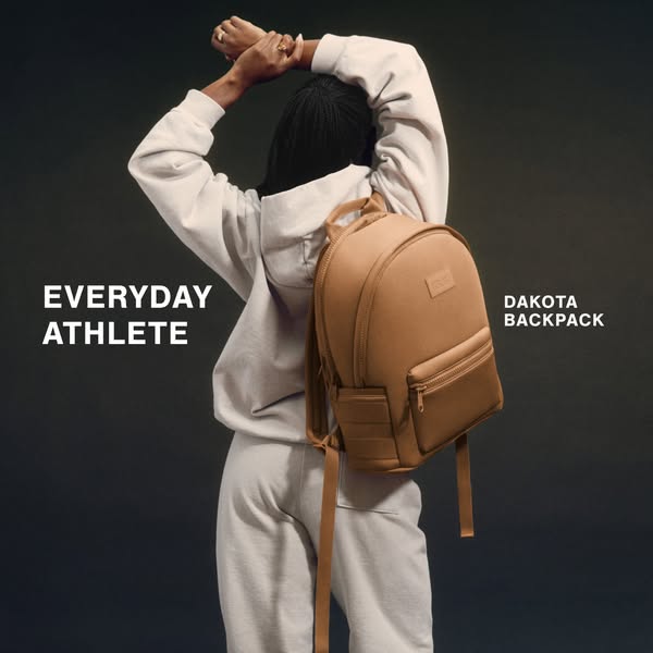 This ad features a person wearing a light-colored sweatsuit and a brown Dakota backpack, which is the main product being
