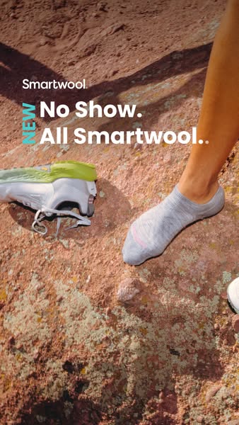 This ad promotes Smartwool’s no-show socks. The image shows a person on a hike who has taken off one of their sneakers. 