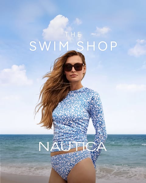 This ad is for Nautica's Swim Shop. It features a woman on a beach wearing a blue and white floral print, long-sleev