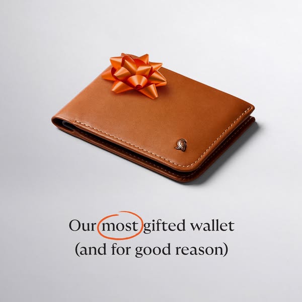 This image ad showcases a brown leather wallet with an orange bow on top, emphasizing its popularity as a gift.