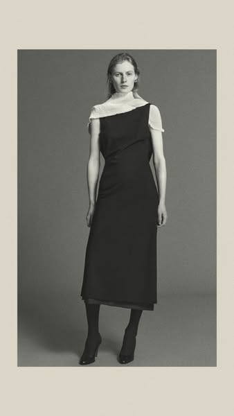A static image of a woman wearing a black dress. The image is black and white with a light tan border.