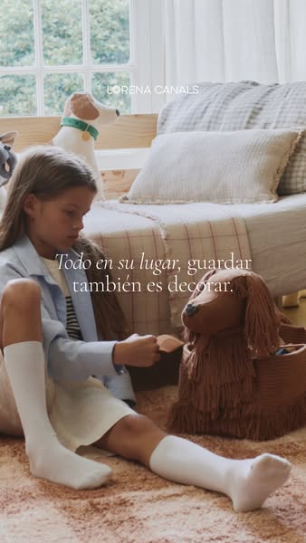 This ad for Lorena Canals depicts a young girl placing a toy in a dog-shaped basket. The headline emphasizes that the it