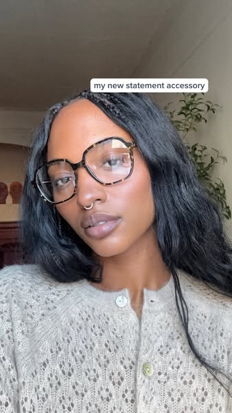 This ad showcases statement glasses worn by an influencer. The ad's headline reads, 'my new statement accessory&