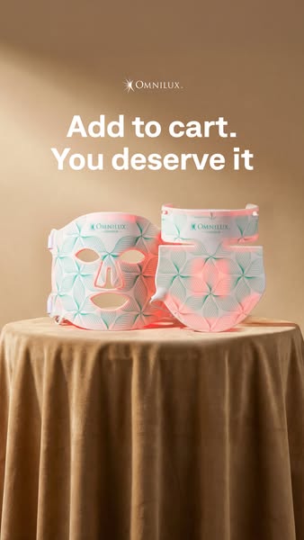 The ad features Omnilux LED masks displayed on a draped table in front of a neutral background. The copy invites the vie