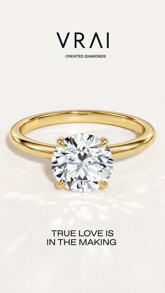 A close up image of a gold VRAI engagement ring with the text, "TRUE LOVE IS IN THE MAKING."