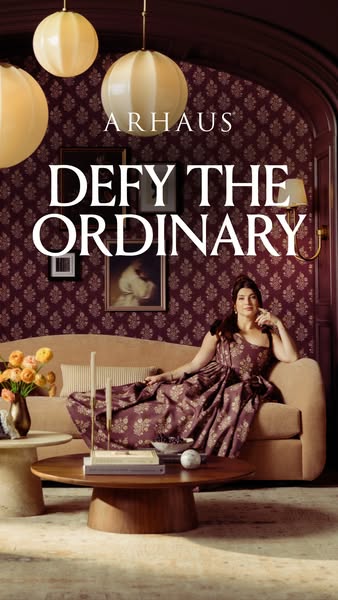 This image ad for Arhaus features a woman sitting on an Arhaus sofa with the tagline "Defy the Ordinary" displ