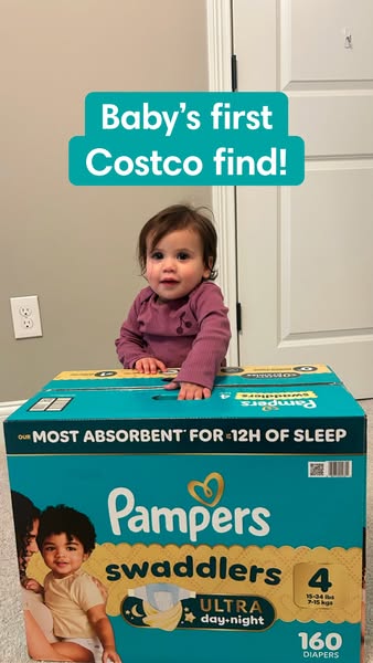 This ad features a baby in front of a box of Pampers Swaddlers Ultra day + night diapers, sold at Costco. The top headli
